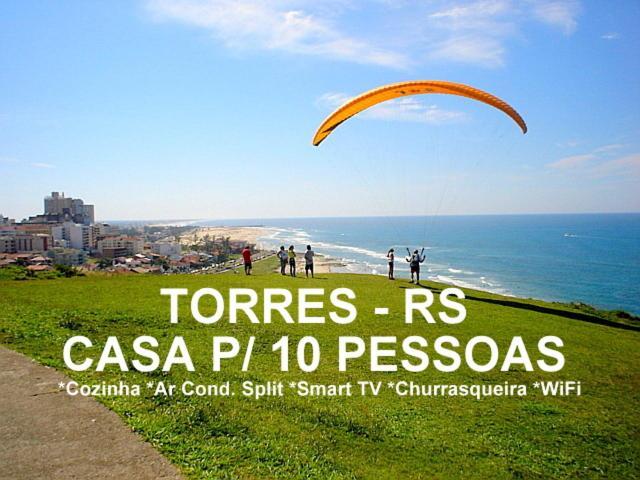 Villa CASA completa em TORRES-RS - O MELHOR CUSTO BENEFICIO na mais bela praia Gaúcha - Cozinha - Banheiro - Ar condicionado - Smart TV 32 Android Apps Youtube - Netflix - Prime Vídeo e Wi-Fi - Estacionamento - Acomoda até 10 pessoas - Anfitriã Superhost n Extérieur photo